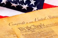 283493-US-Constitution-and-American-Flag-Stock-Photo.jpg